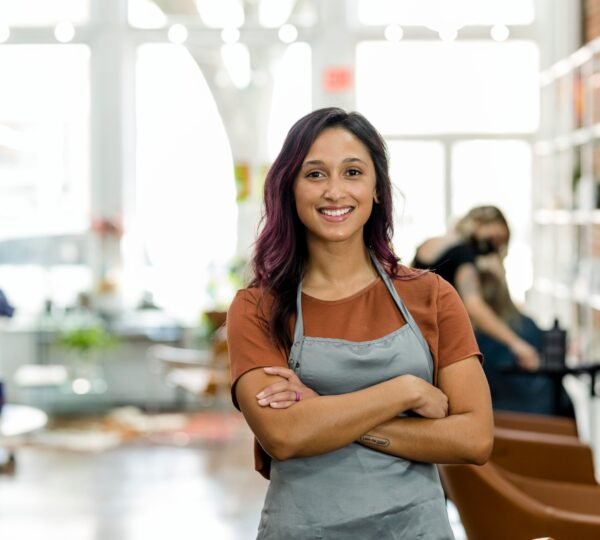 Smiling small beauty salon owner